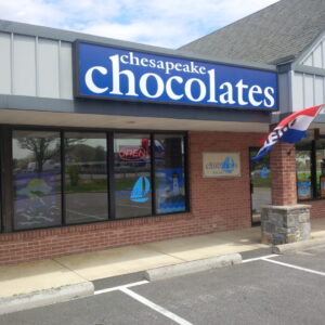 The storefront of Chesapeake Chocolates, a local chocolate shop in Stevensville, MD.