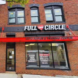 The storefront of Full Circle Auto Repair & Training Center, a local auto repair shop in Baltimore, MD.