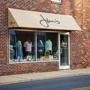 The storefront of John's Men's Clothing, a men's clothing store in Bel Air, MD.