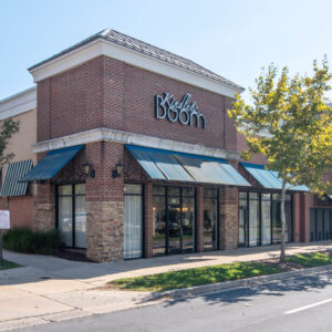 The storefront of Kindle & Boom, a salon in Rockville, MD.