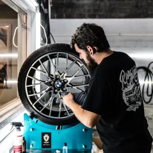 An employee of Rise and Shine Detailing, a local car detailing shop in Crofton, Maryland.