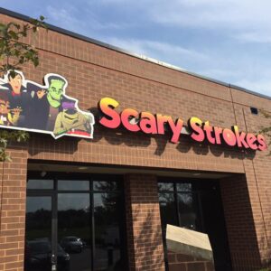 The storefront of Scary Strokes, a locally owned indoor mini golf course in Maryland.
